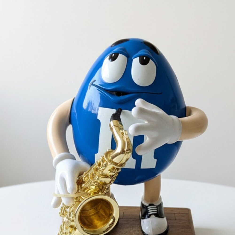 M&M'S Blue Figure with Gold Saxophone Art Piece